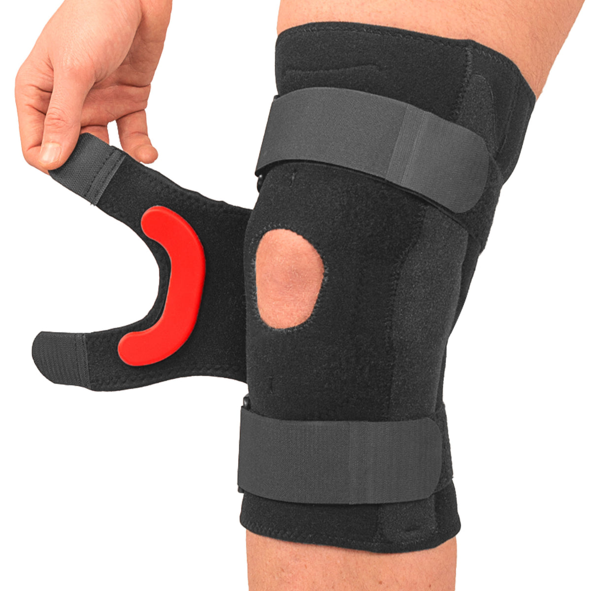Model in the process of applying removable and adjustable patella strap with lateral-j silicone buttress attached to the inside to the strap