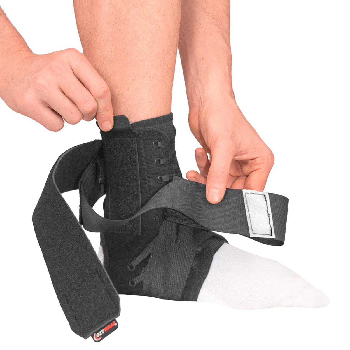 Model highlighting the heel lock hook on both straps and the stay pocket