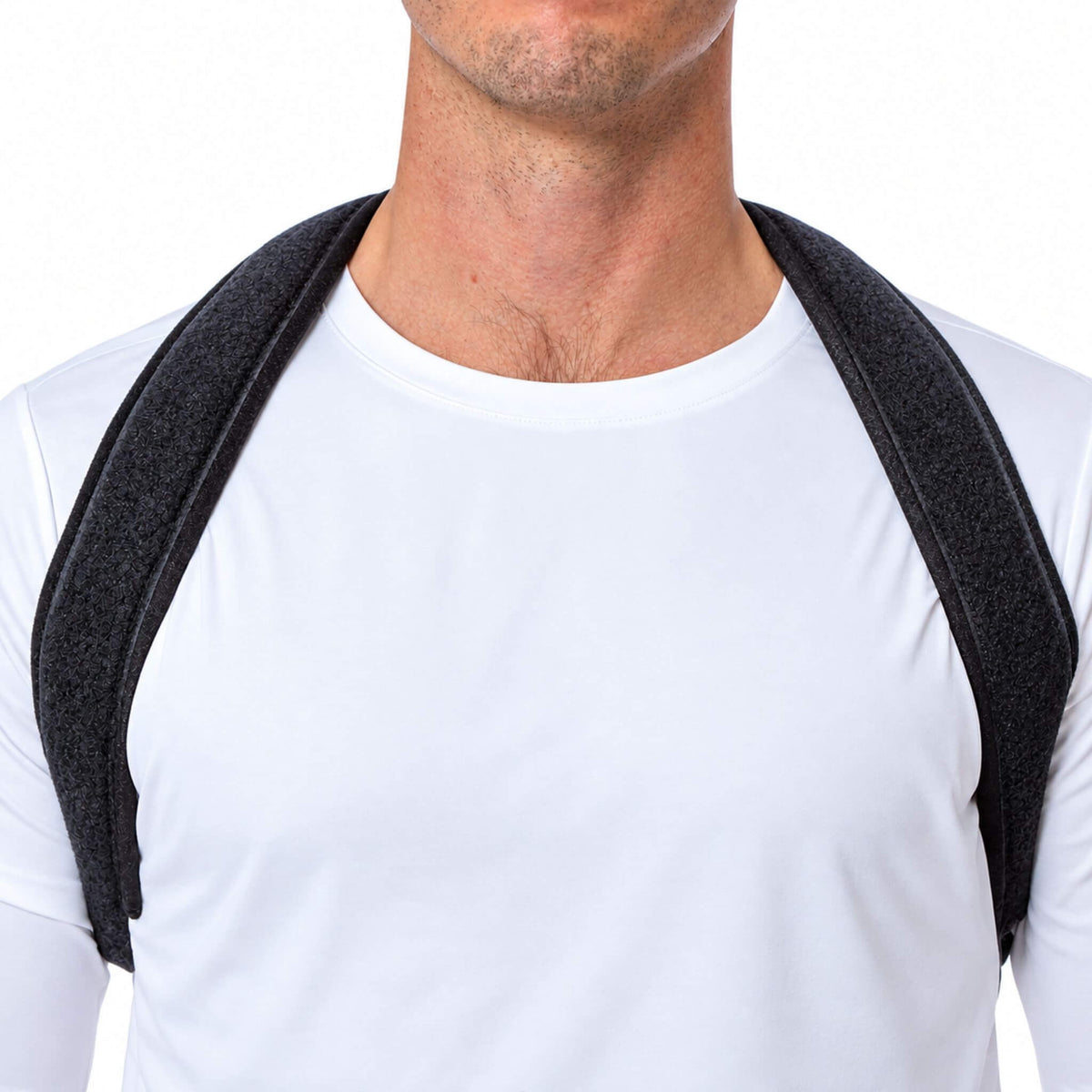 Front view of a man wearing a clavicle support brace with wide padded shoulder straps designed for comfortable collarbone support.