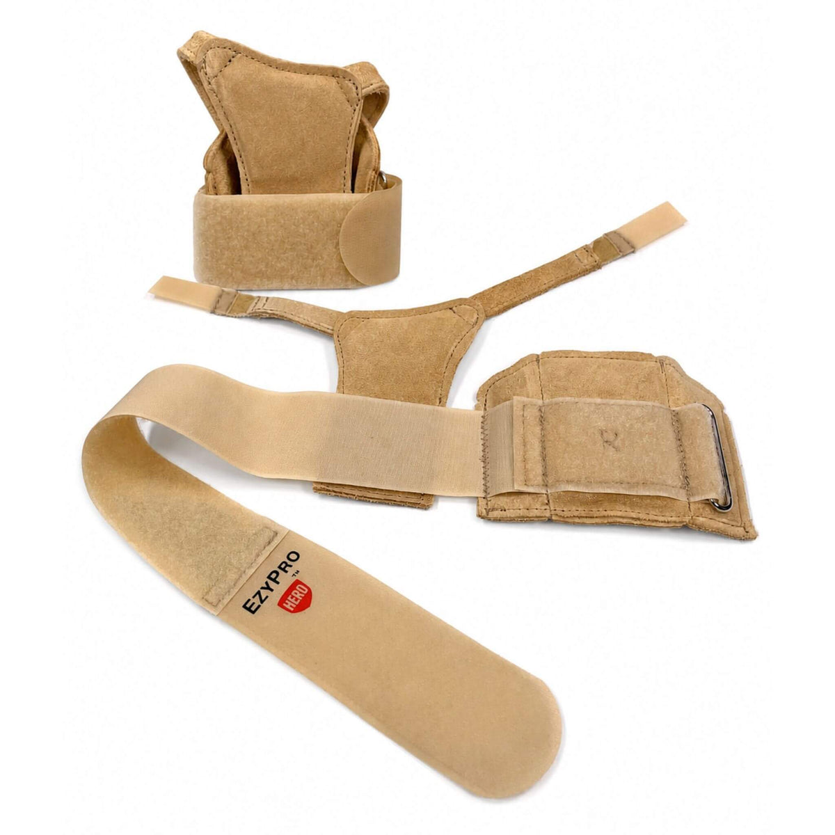 Disassembled EZYPRO HERO gymnastics wrist brace showing removable palm pad, cross straps, and adjustable support components.