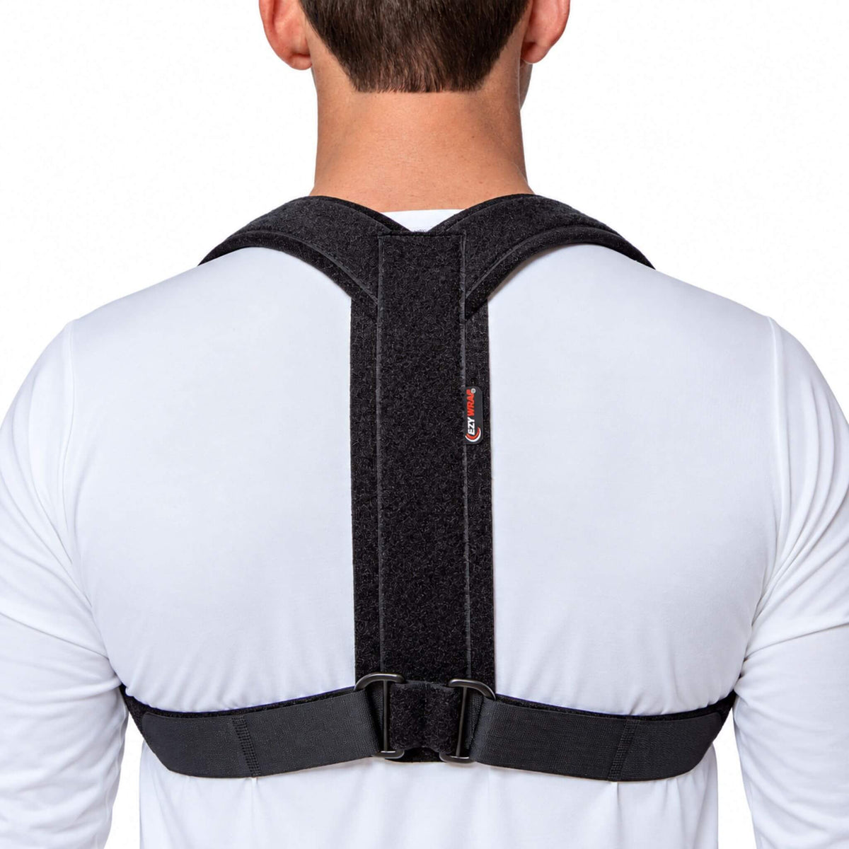 Rear view of a man wearing a figure 8 clavicle brace with padded shoulder straps and adjustable closures for collarbone fracture support.